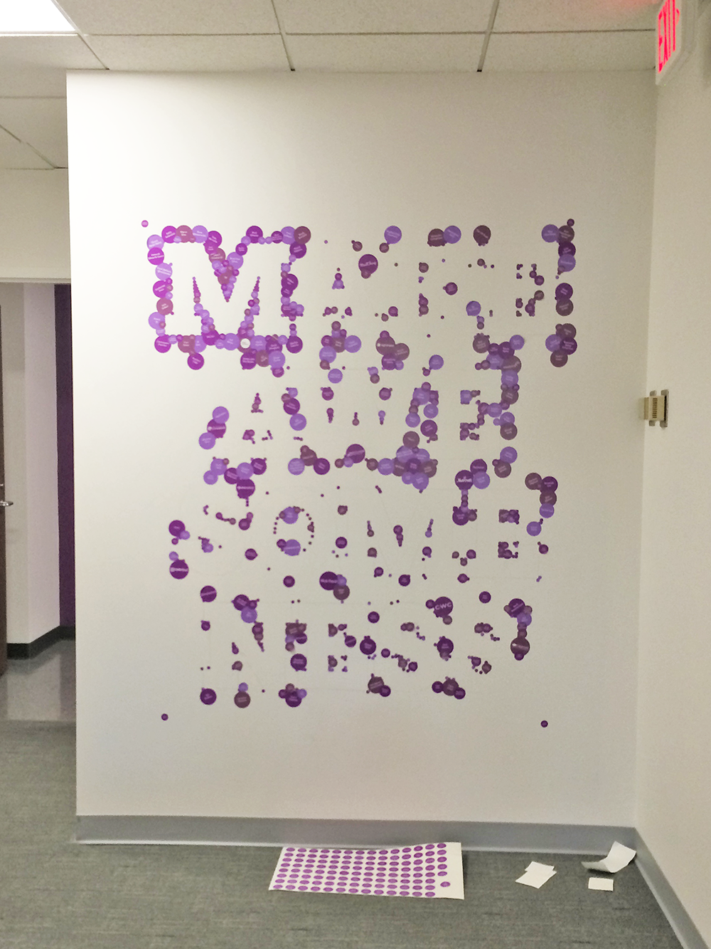 Sticker by sticker, we added the names of our Kickstarter backers to the wall.